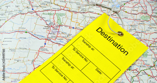 yellow luggage tag and map photo