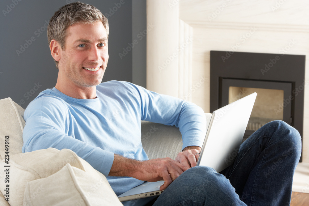 Man Using Laptop Relaxing Sitting On Sofa At Home Man Using Laptop Relaxing Sitting On Sofa At Home