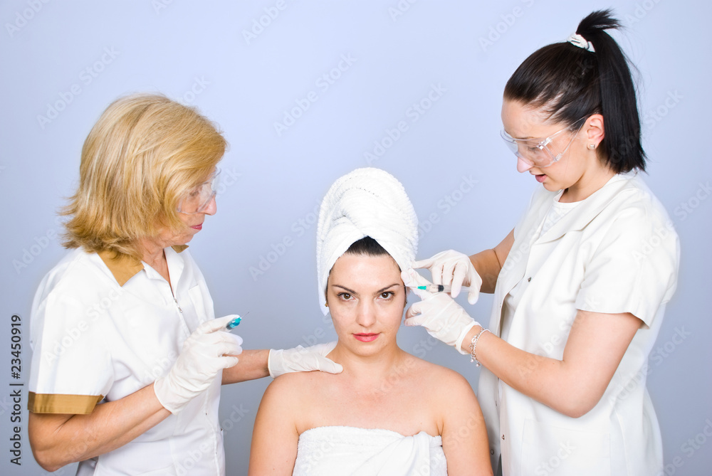 Woman getting botox inject to eyebrow Woman getting botox inject to eyebrow