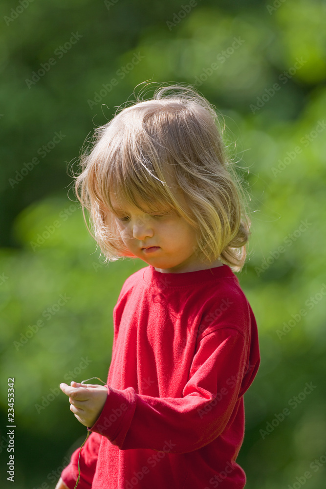 boy with grass straw