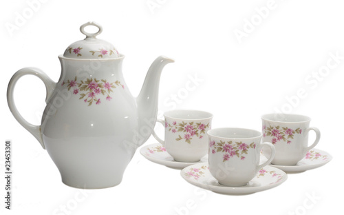 coffee-pot and three cups of coffee isolated on white.