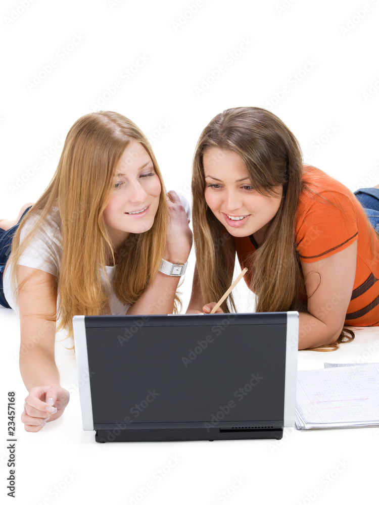two young happy student girl work on laptop computer isolated on two young happy student girl work on laptop computer isolated on