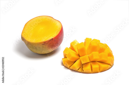 Sliced half of a ripe mango isolated on white background