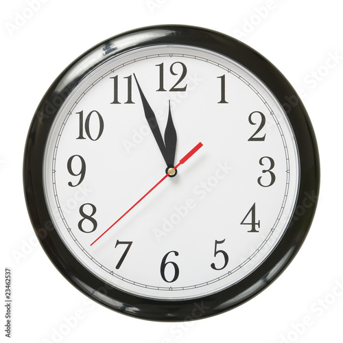 closeup of a simple plastic clock isolated on white