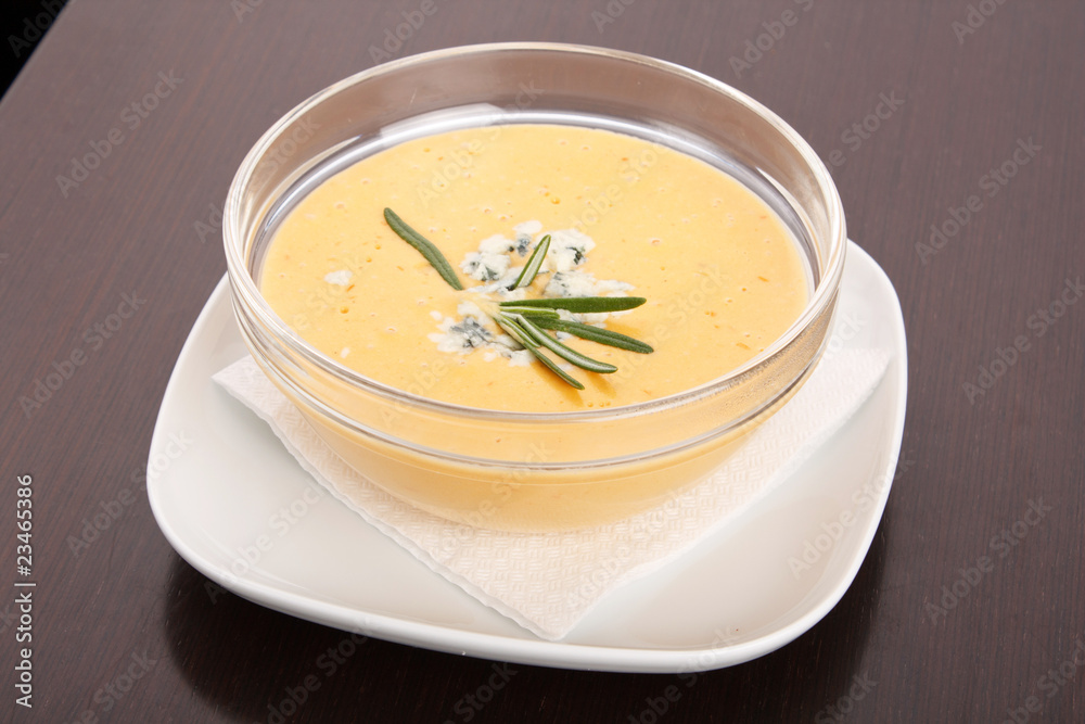 Bowl of hot delicious pumpkin soup with blue cheese Bowl of hot delicious pumpkin soup with blue cheese