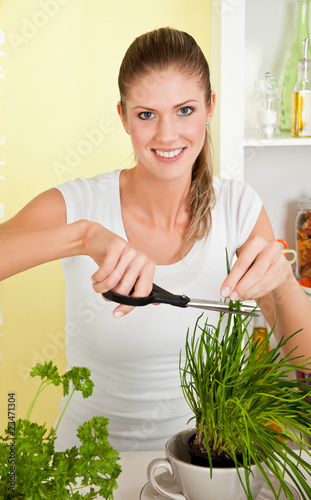 Young beauty woman cut chives
