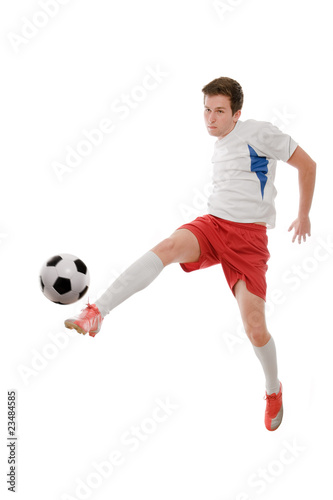 Soccer player kicking the ball isolated on white © Alexander Raths