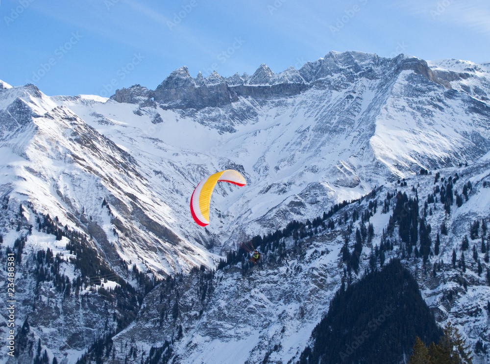Paragliding in alps mountains