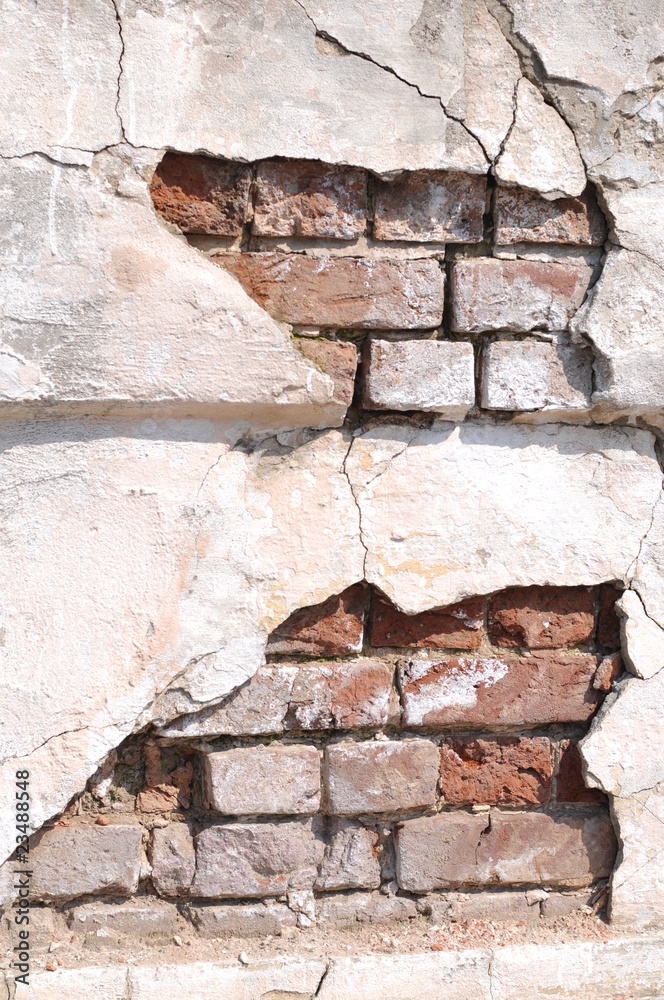 old brick wall with cracked plaster old brick wall with cracked plaster