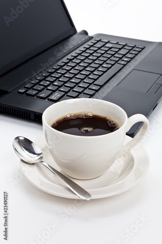 Coffee cup and computer