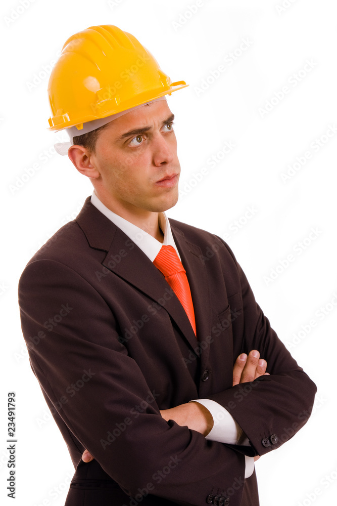 Pensive young engineer with a yellow helmet on white background Pensive young engineer with a yellow helmet on white background