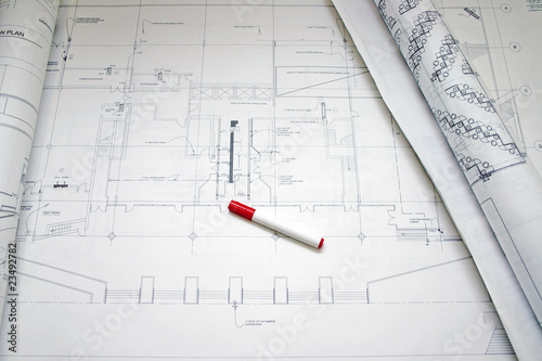 Opening rolls of floor plan drawing and water mark pen.