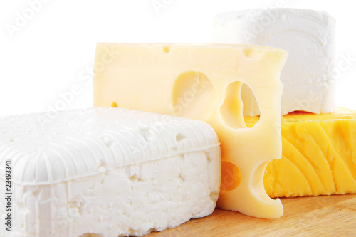 cheeses on wooden board