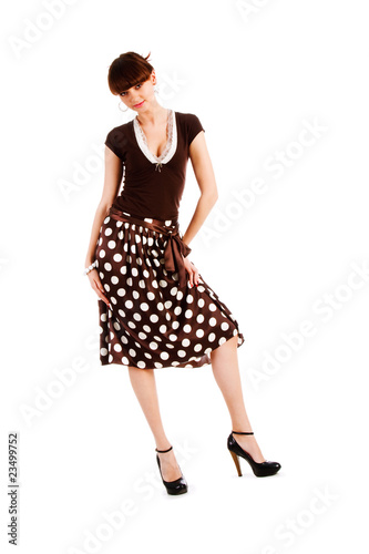 Alluring young girl in spotted skirt