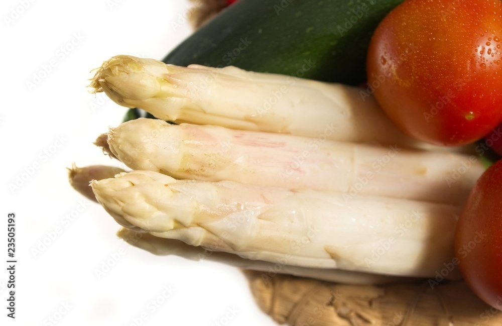 White asparagus in a basket of fresh vegetables White asparagus in a basket of fresh vegetables