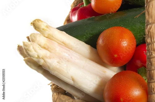 White asparagus in a basket of fresh vegetables