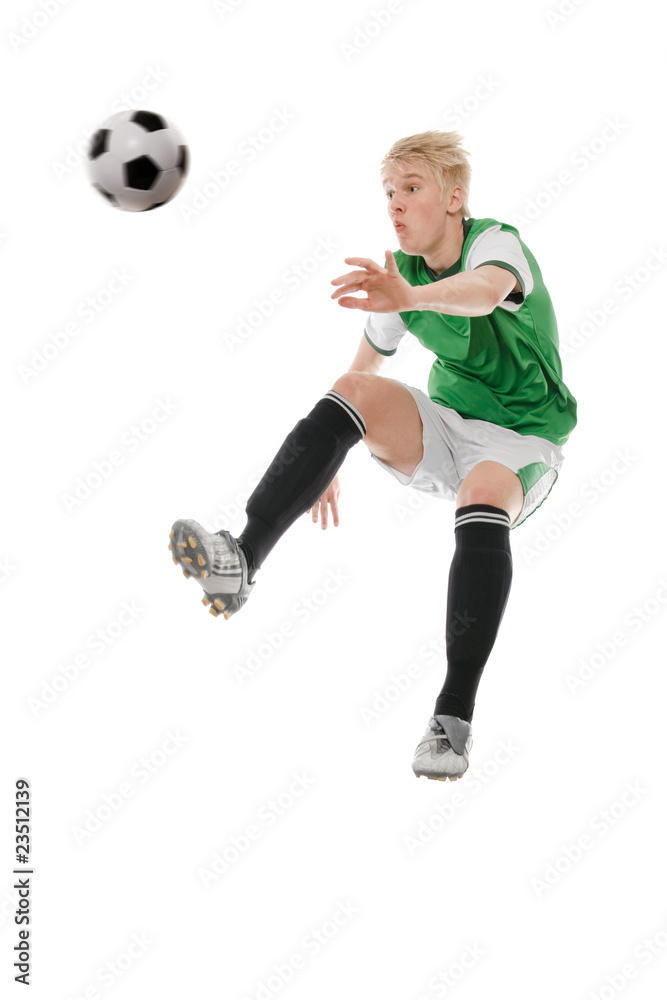 Soccer player kicking the ball isolated on white Soccer player kicking the ball isolated on white