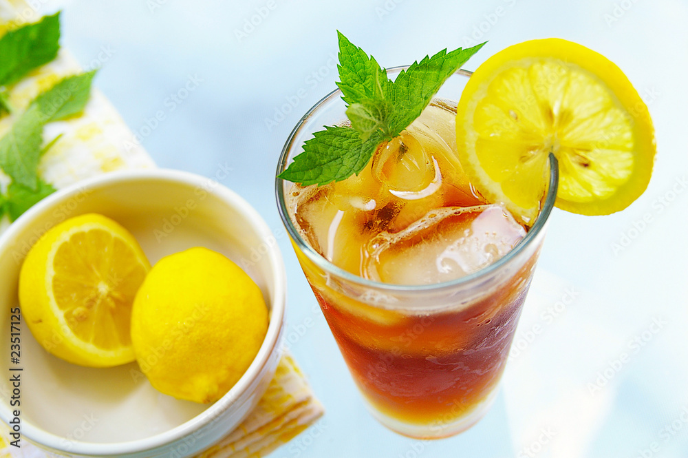 tall glass of iced tea with lemon and fresh mint tall glass of iced tea with lemon and fresh mint