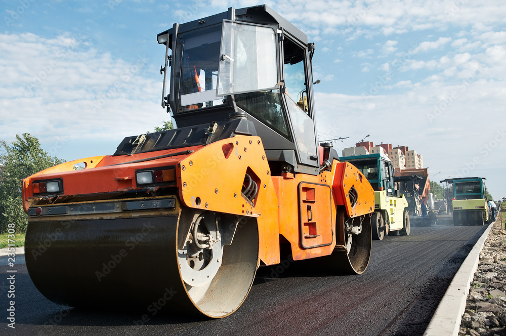 Vibration Compactor at asphalt pavement works (wide angle)