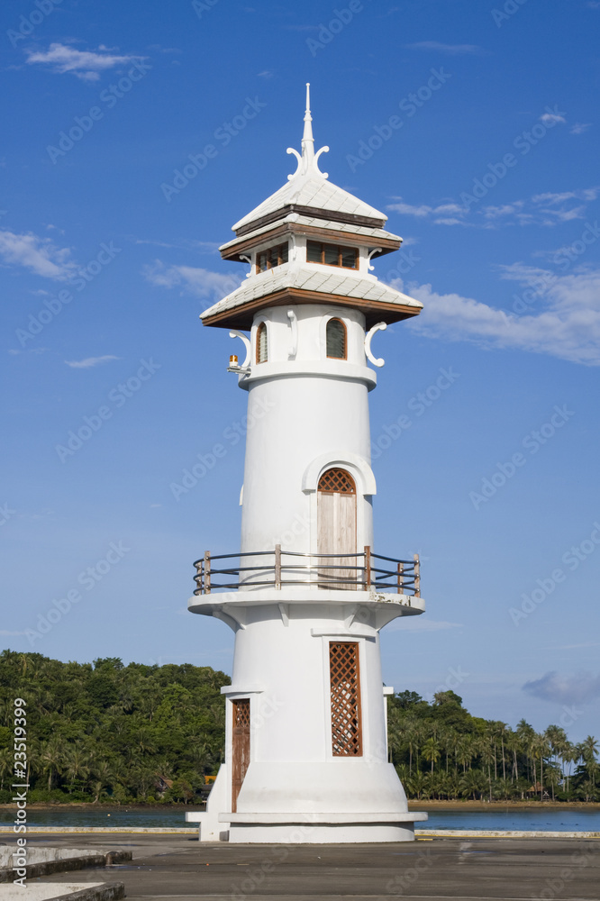 White lighthouse in bay on Koh Chang island, Thailand