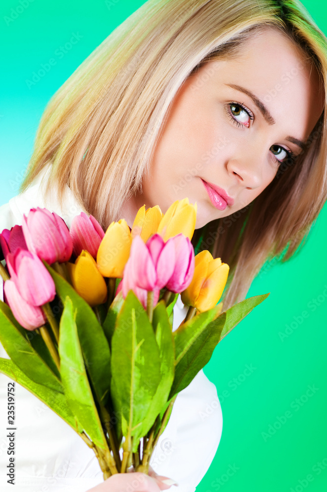 Young girl with tulips against colourful background Young girl with tulips against colourful background