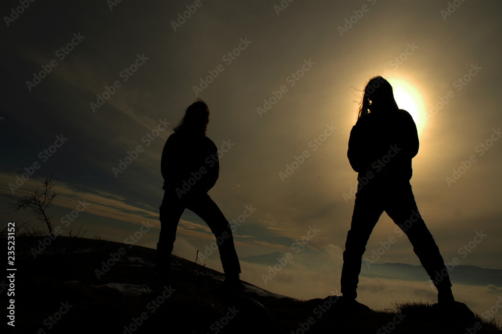 Silhouette of rockers in the darkness