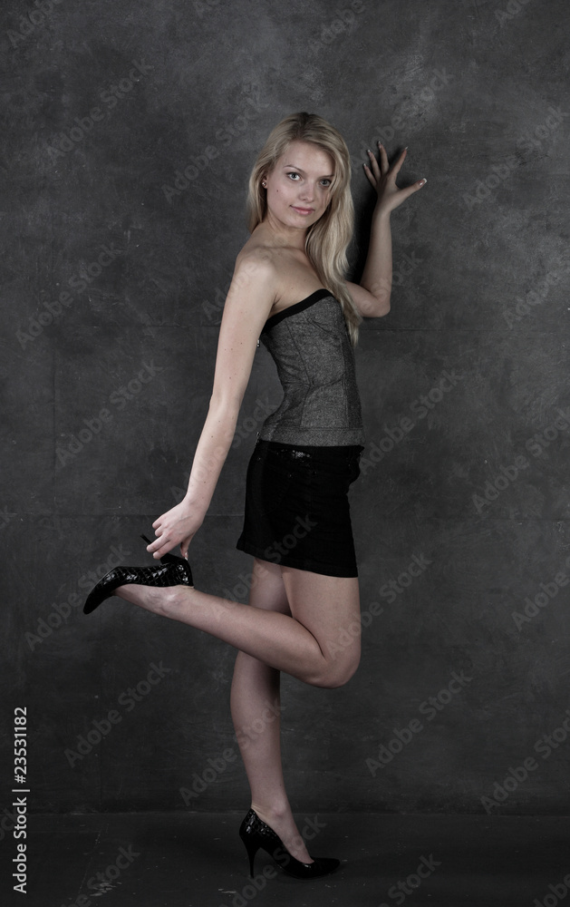 beautiful girl with long hair costs at dark wall beautiful girl with long hair costs at dark wall