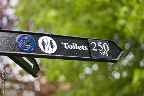 Toilets This Way Sign Post