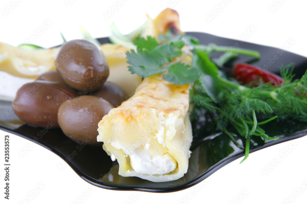 cannelloni served with pepper and olives cannelloni served with pepper and olives