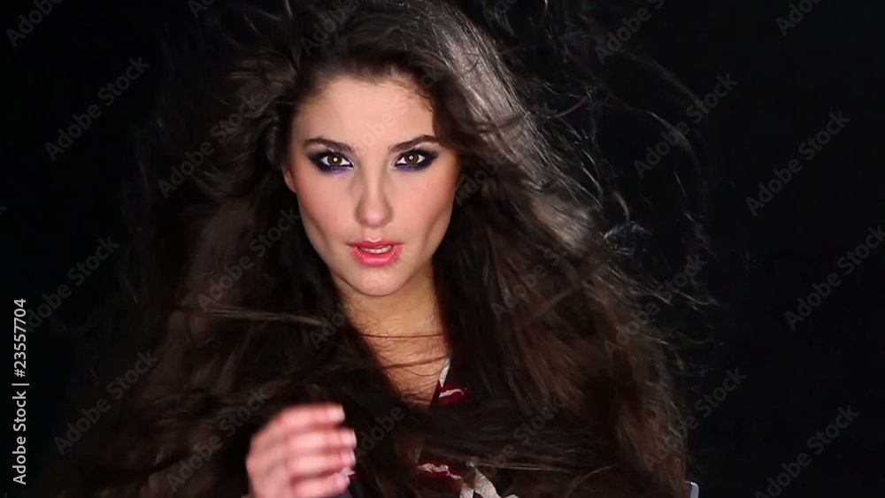 Portrait of beautiful young woman with wind in hair Portrait of beautiful young woman with wind in hair