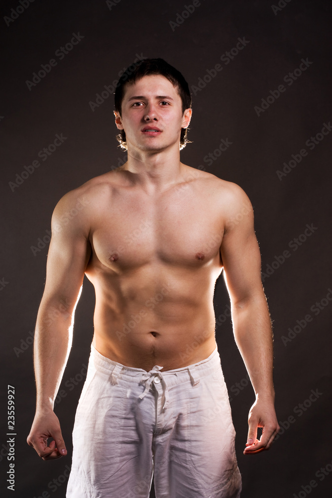 Handsome guy inflated on a black background Handsome guy inflated on a black background