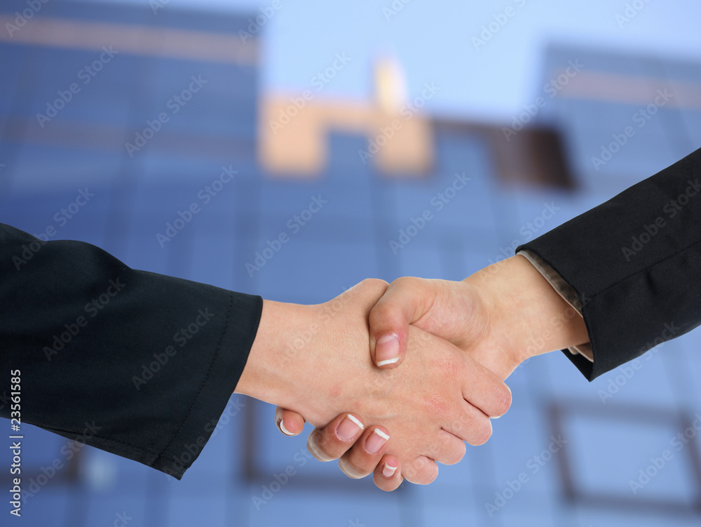 Architectural Handshaking in front of building