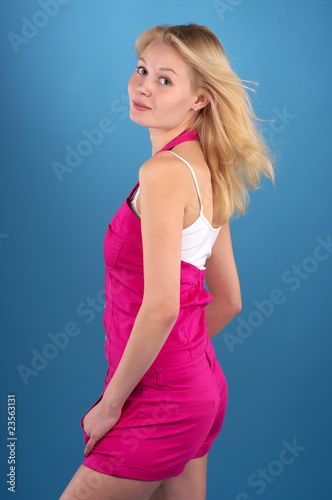 Beautiful blond woman over blue background
