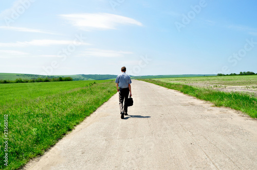 The man goes away on the road