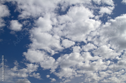 Blue sky with white fluffy clouds.