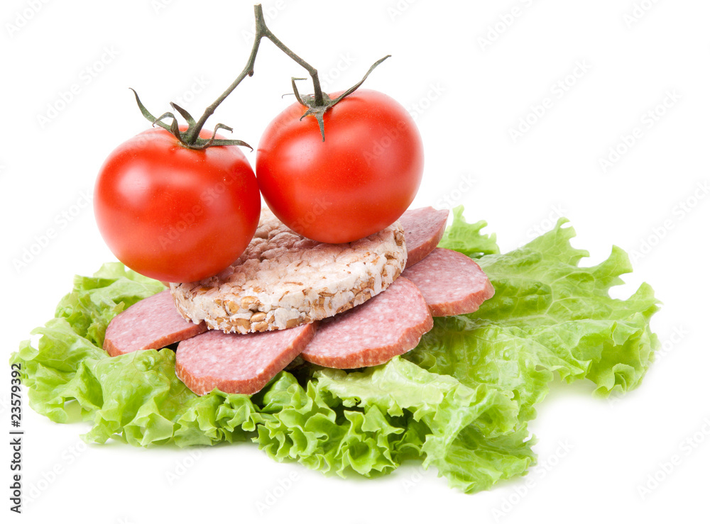 Sandwich with sausage, tomatoes and salad