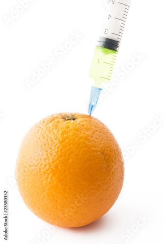 Juicy Orange with medical syringe.