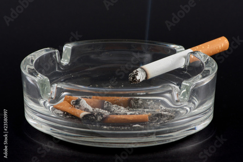 Cigarette and ashtray photo