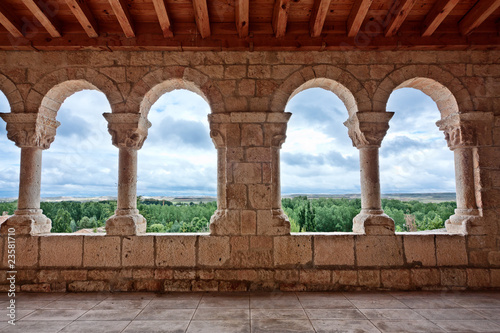 Landscape seen through romanesque church archs photo