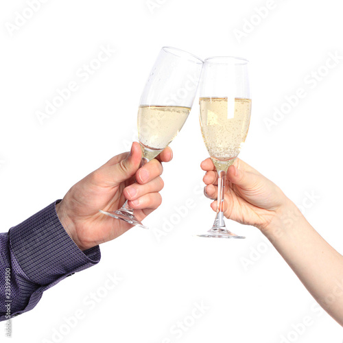 Two hands with glasses of champagne isolated on a white backgrou