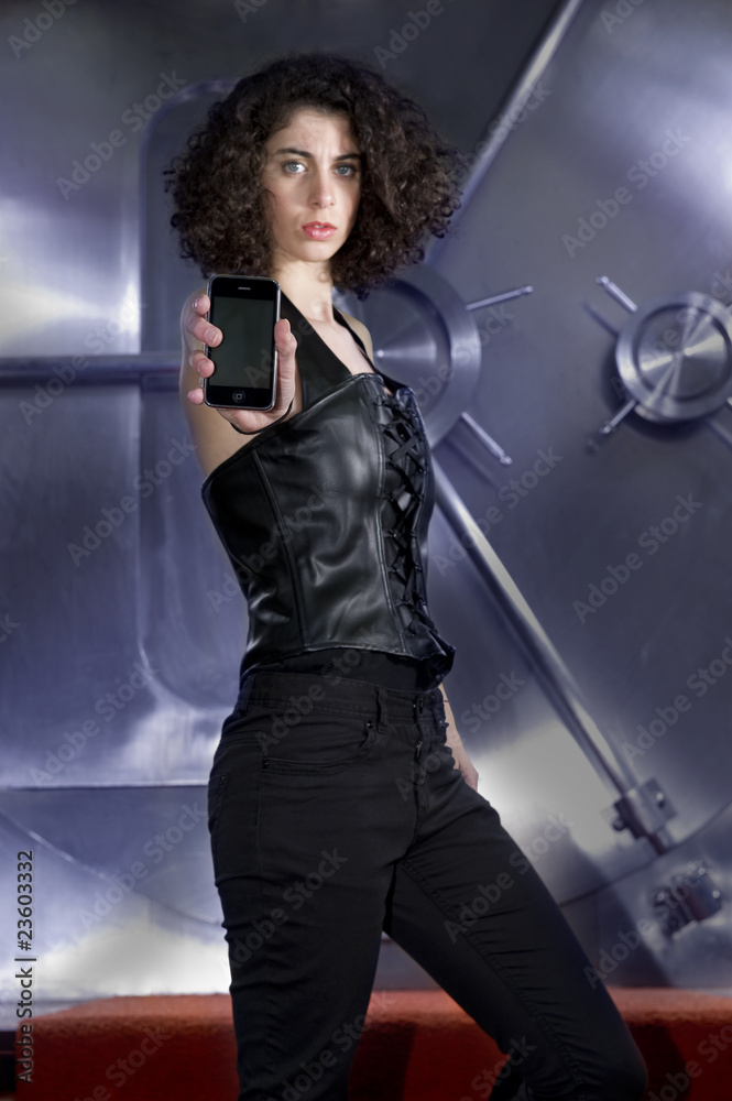 Naklejka premium Female Criminal threatening in front of bank vault