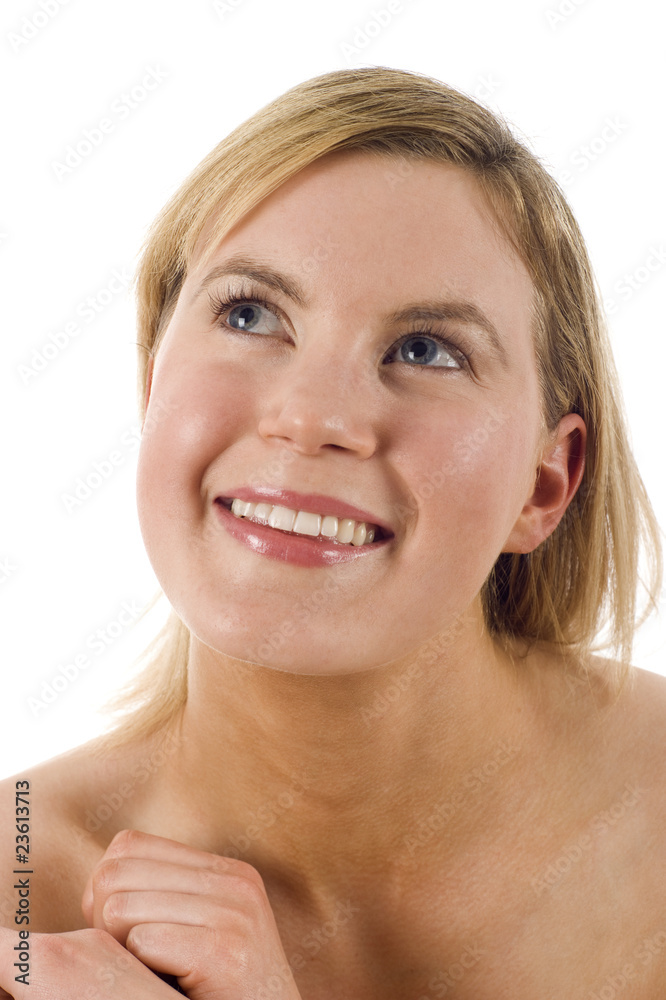 Closeup of a beautiful woman with bare shoulders looking up Closeup of a beautiful woman with bare shoulders looking up