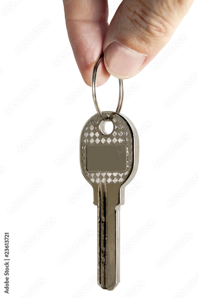key in fingers isolated on a white background key in fingers isolated on a white background