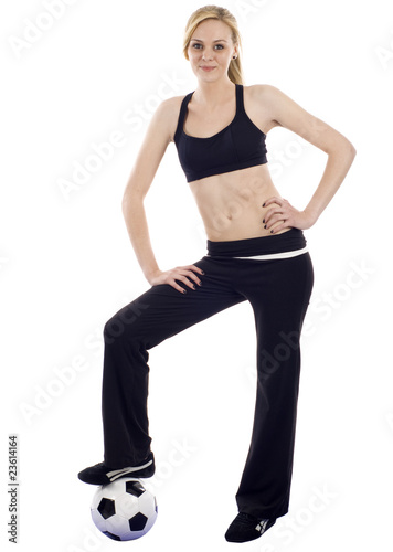 Full Length of a Athletic Woman with a Soccer Ball Football