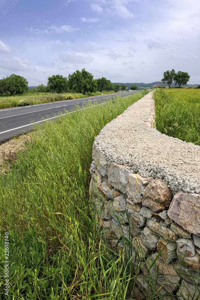 Dry stone wall bordering a field by the roadside MA-3232 near Si