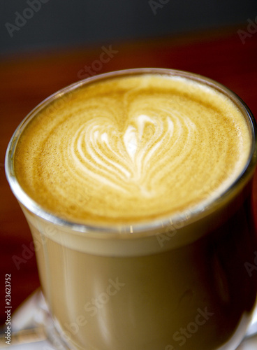 Latte coffee with a love heart design in shallow focus