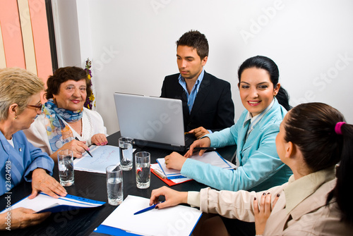 Business people having conversation at meeting