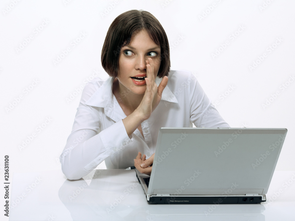Young business woman tells a trade secret Young business woman tells a trade secret