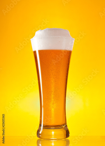 Full glass of beer with froth