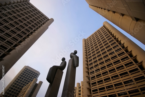 Statues among high-rises photo